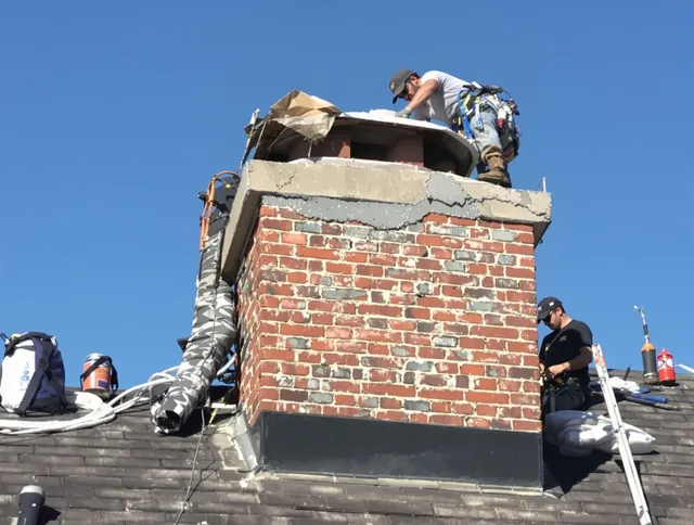 Inglewood Chimney Sweep installing a custom chimney crown in Inglewood, CA