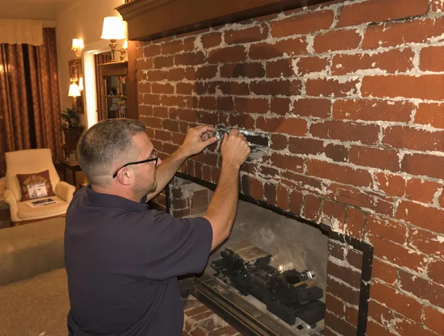 Inglewood Chimney Sweep expert fixing a fireplace in Inglewood, CA